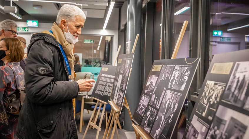 Person reads information boards of University of Leicester history