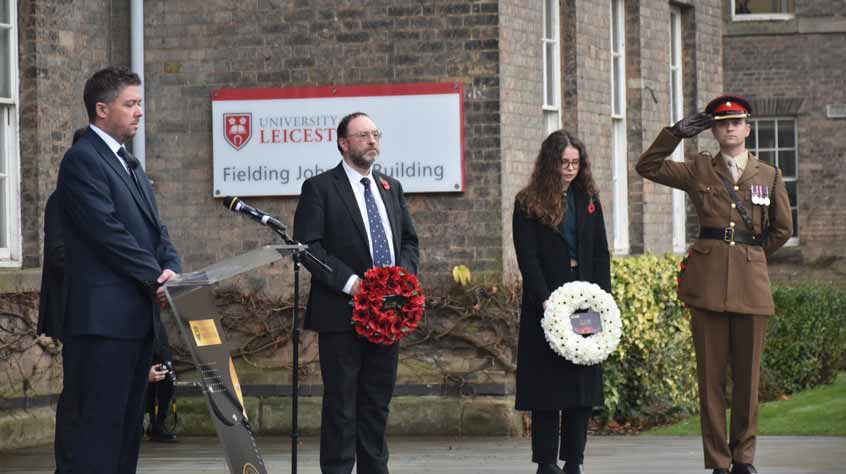 People stand in silence for 2 minute silence on 11/11