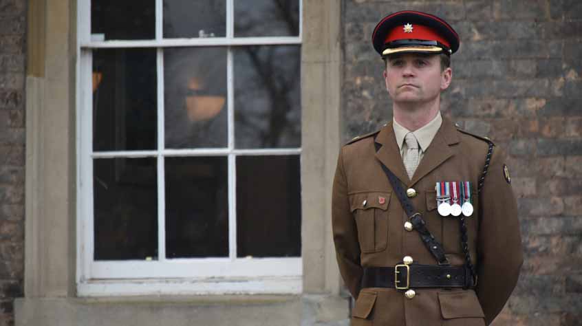 Major Ed Matts standing to attention