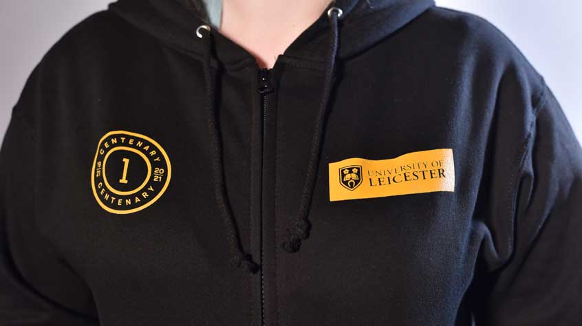 Person wearing a centenary branded hoodie