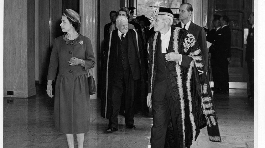 Queen Elizabeth II arrives in the Percy Gee Entrance accompanied by the Chancellor, H. Percy Gee and Prince Philip