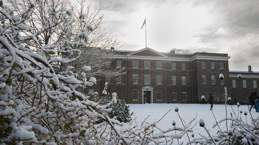 Fielding Johnson building on Leicester campus covered in snow.