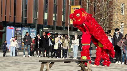 Full view of Lion dance at the 2002 Lunar New Year celebrations on Centenary Square at the University of Leicester