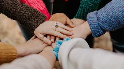 A groups of hands signifying teamwork
