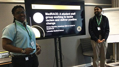 Two student presenting at a conference