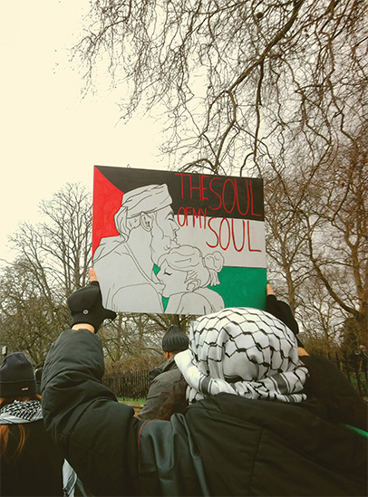 Photograph of an artwork held up within a march