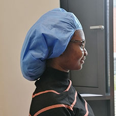 Student in scrub cap side view