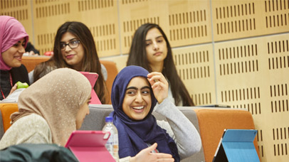 Students chatting in a lecture theatre