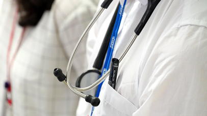 Cropped female and male medical persons