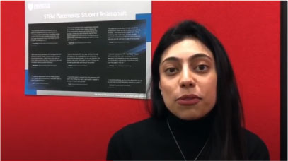 A student stands in front of a red screen talking about support offered at the University of Leicester