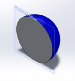 A blue 3D sphere that has been cut in half to expose a grey circular cross section.