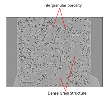 A grey scale image showing solid grey sections indicating grains surrounded by dark black features indicating porosity