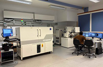 The Hercules facility including a scientist working at a screen attached to the FIB.