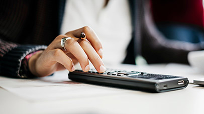 Close up of student using a calculator. 