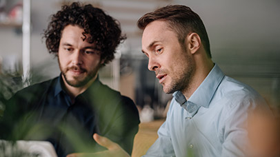 Two business men discussing work. 