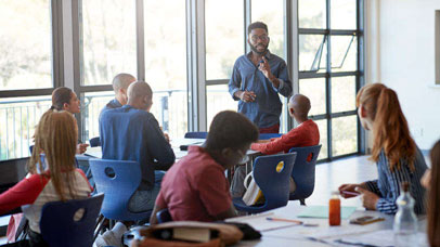 Teacher speaking to a class of students