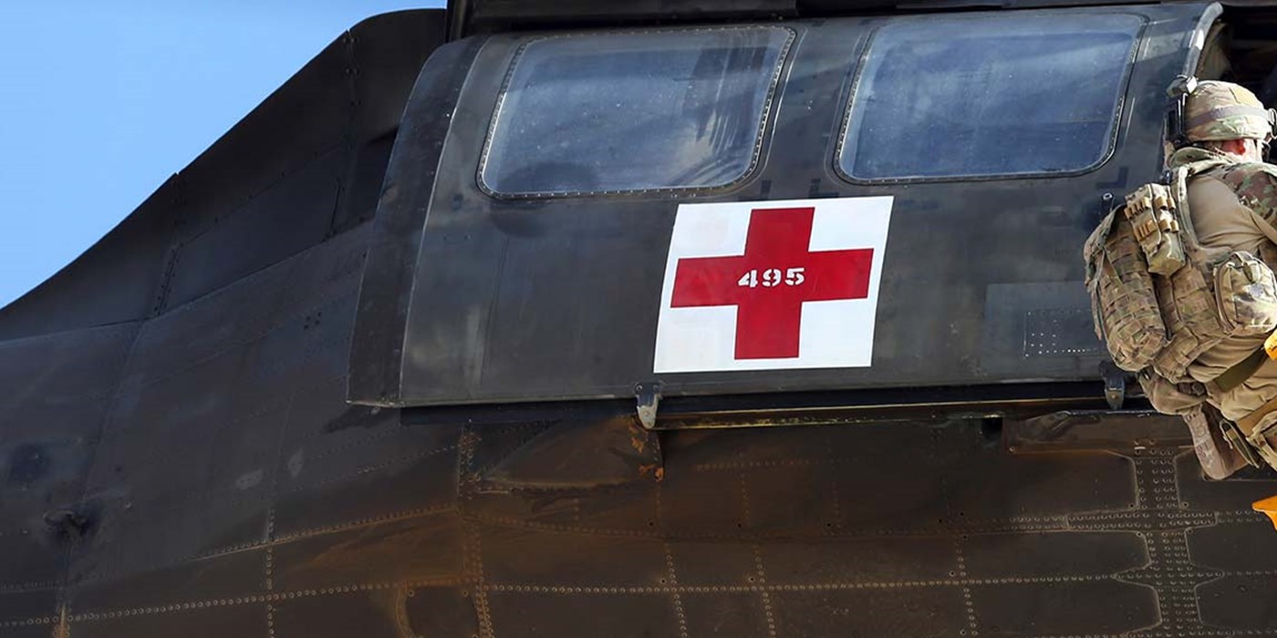 medical soldiers exiting a holicopter