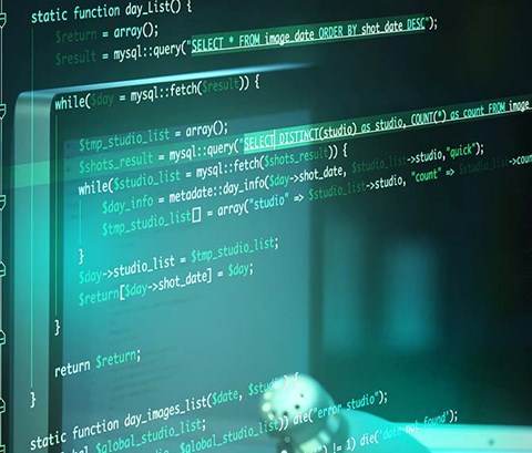 abstract image of man reading computer code