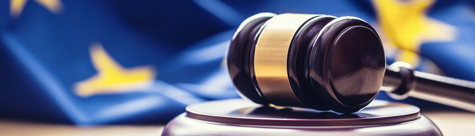 judges hammer with a european flag in the background