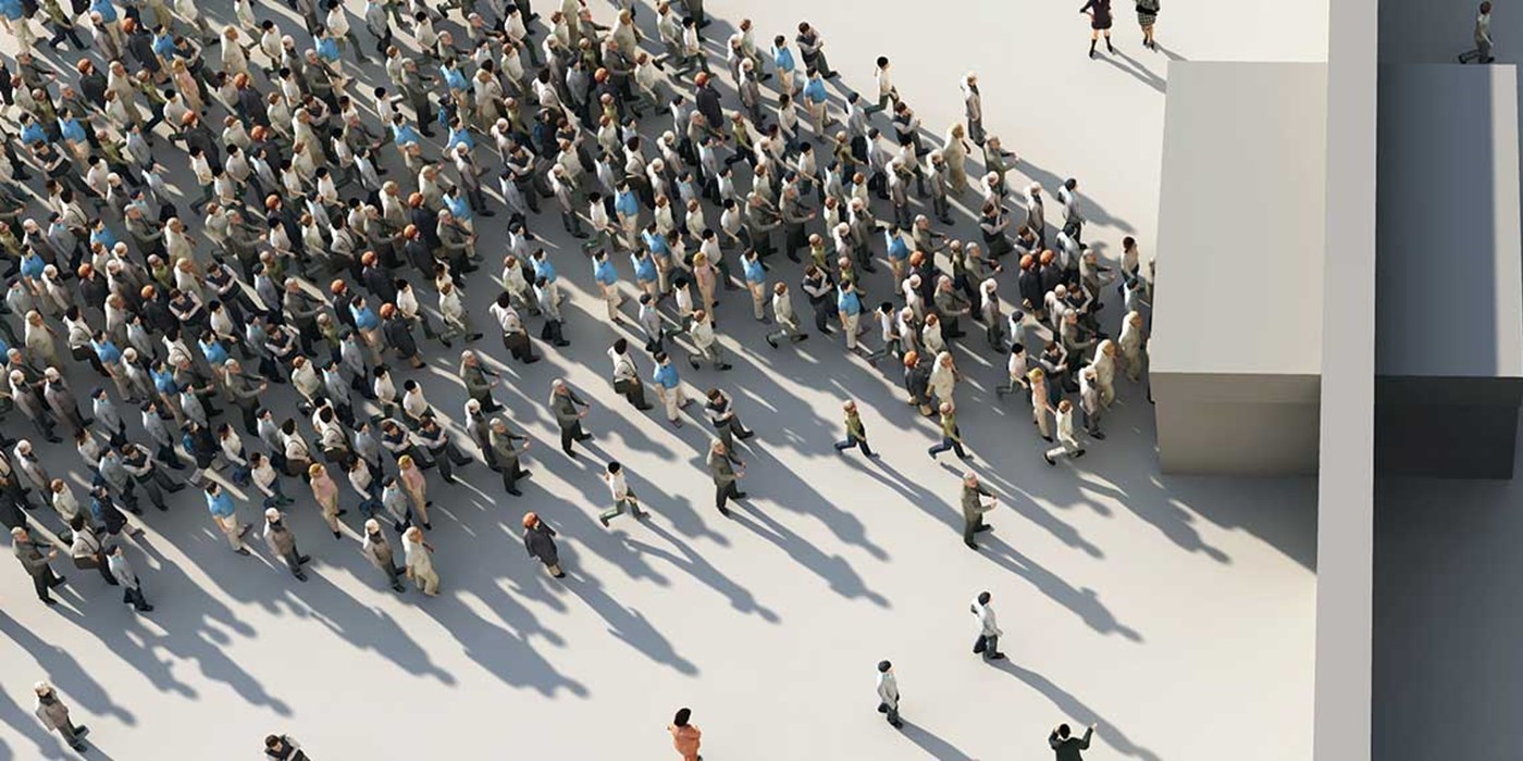 abstract image of a large group of people passing through a chackpoint