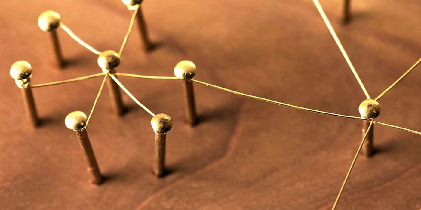 abstract close up showing social connections as pins connected via wire