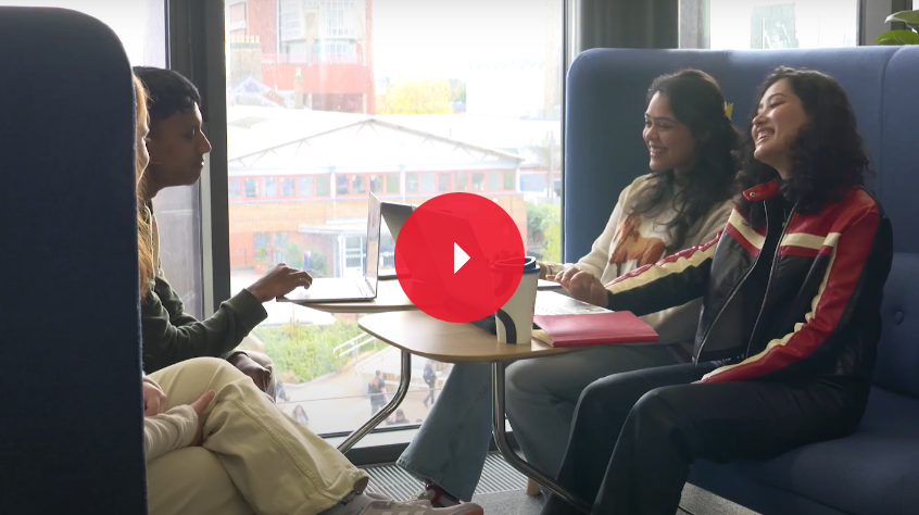 Three students sitting and talking