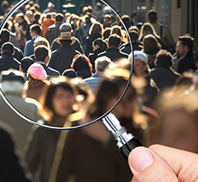 people on the street through a magnifying glass
