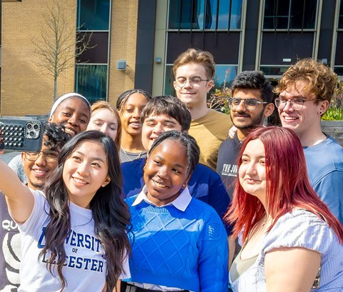 Group of students taking a selfie on the University of Leicester campus