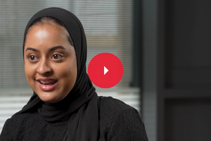 Profile of smiling student facing camera directly