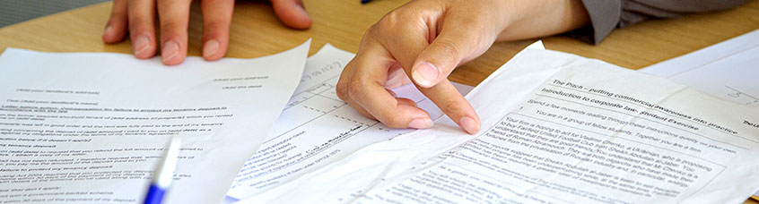 Students at the free legal advice clinic looking at paperwork