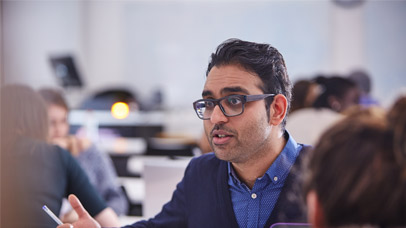 Lecturer talking to students