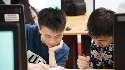 Two students working at a computer
