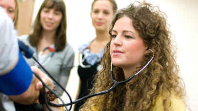 Student using a stethoscope 