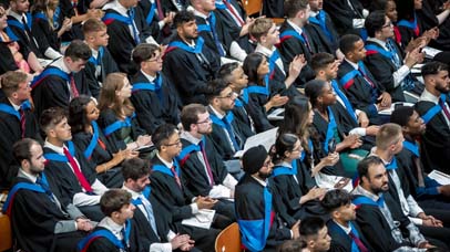 Front view of the Graduands watching on during the ceremony at De Montfort Hall