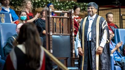 President and Vice-Chancellor Professor Nishan Canagarajah smiling during the ceremony at De Montfort Hall