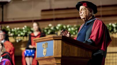 A Man giving a speech at the ceremony in De Montfort Hall