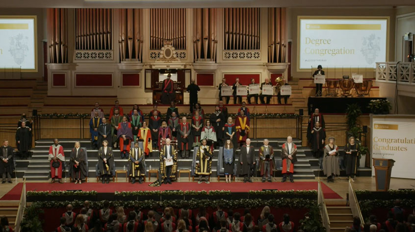 View of the stage of De Montfort Hall during a graduation ceremony