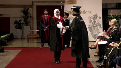 Students walking across at the Graduation ceremony on Thursday afternoon ceremony at DeMontfort Hall