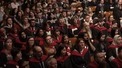 Graduates looking on at University of Leicester Graduation ceremony DeMontfort Hall 23 July 2023