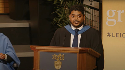 Student addressing fellow graduates towards the end of their graduation ceremony