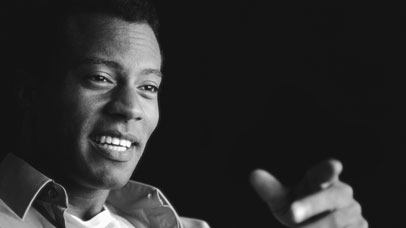 Man smiling and pointing