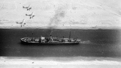 Aerial shot of boat floating in Suez canal