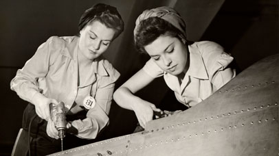 Women working on a WWII aircraft.