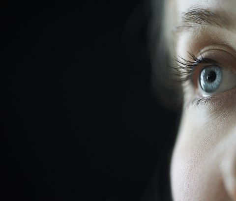 Half a womans face - blue eye looking across - ESRC 