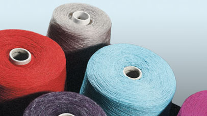 multicoloured cotton bobbins red blue purple pink and grey