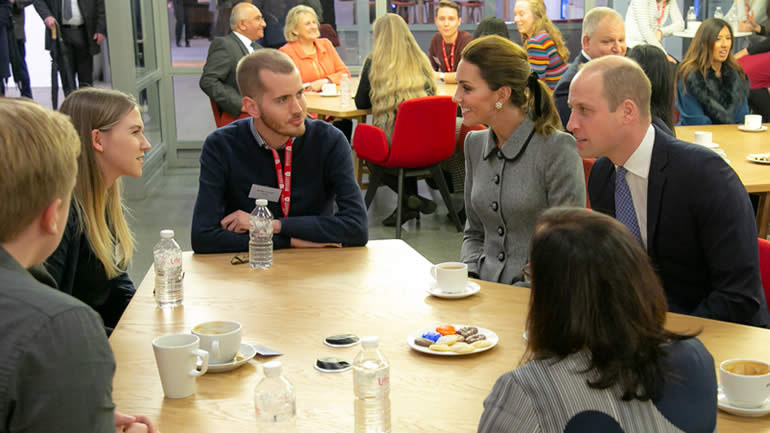 Will and Kate in cafe, speaking to people