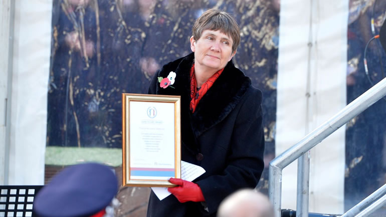 Woman accepting award