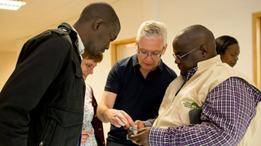 Dr Jon Wetton demonstrating the MinION handheld DNA sequencer.