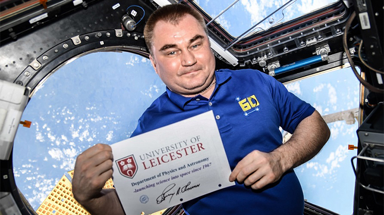 Image of astronaut with University of Leicester sign