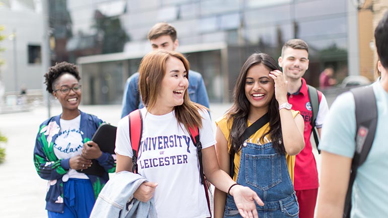 students laughing on campus